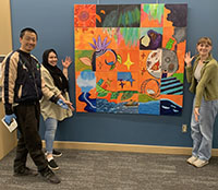 Peng Wu, Emma Karras and Shanze Hayee with artwork