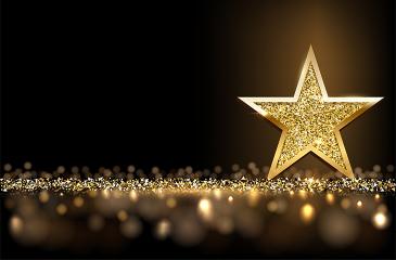 Golden sparkling star isolated on dark luxury horizontal background