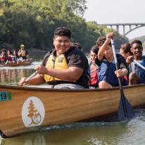 children on canoe trip in river